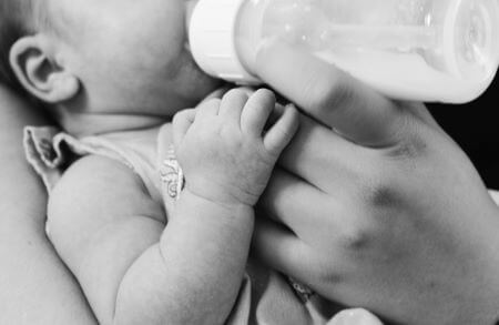 Baby drinking milk from a bottle