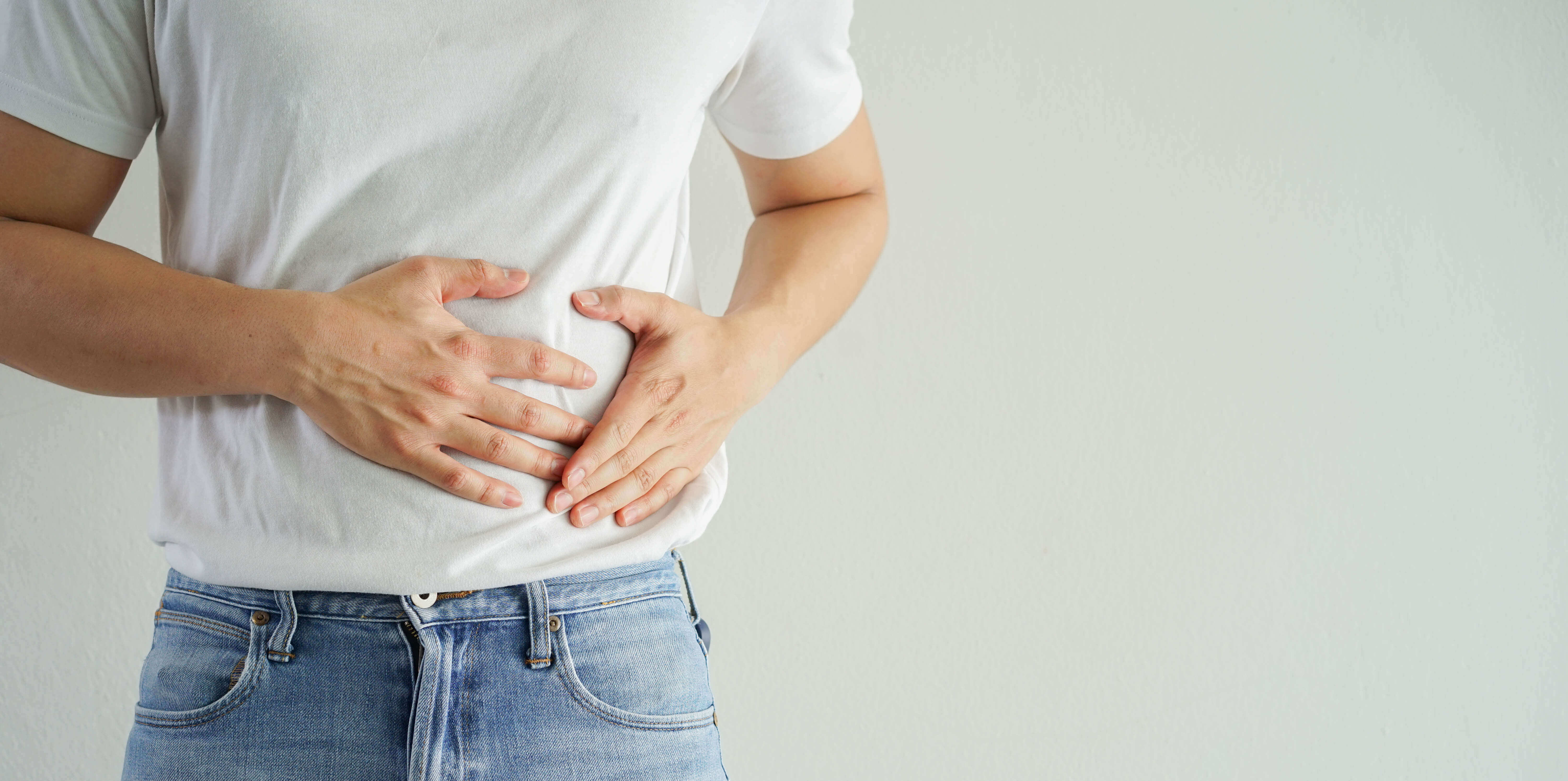 man holding stomach in pain