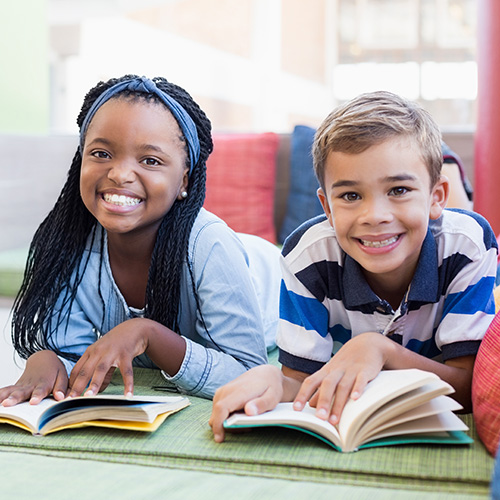 Two children each reading a book