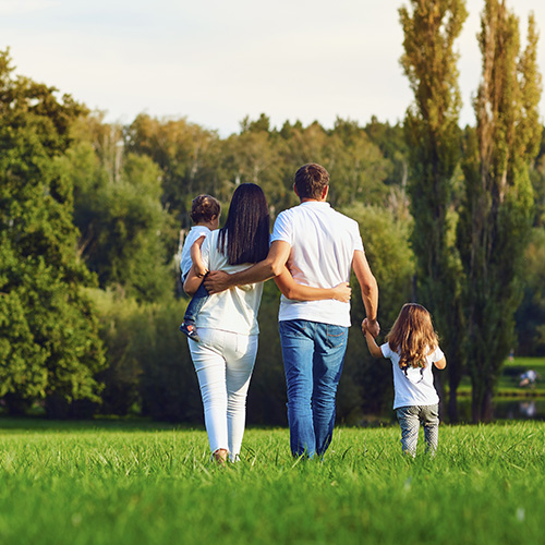 Family going for a walk in the park.