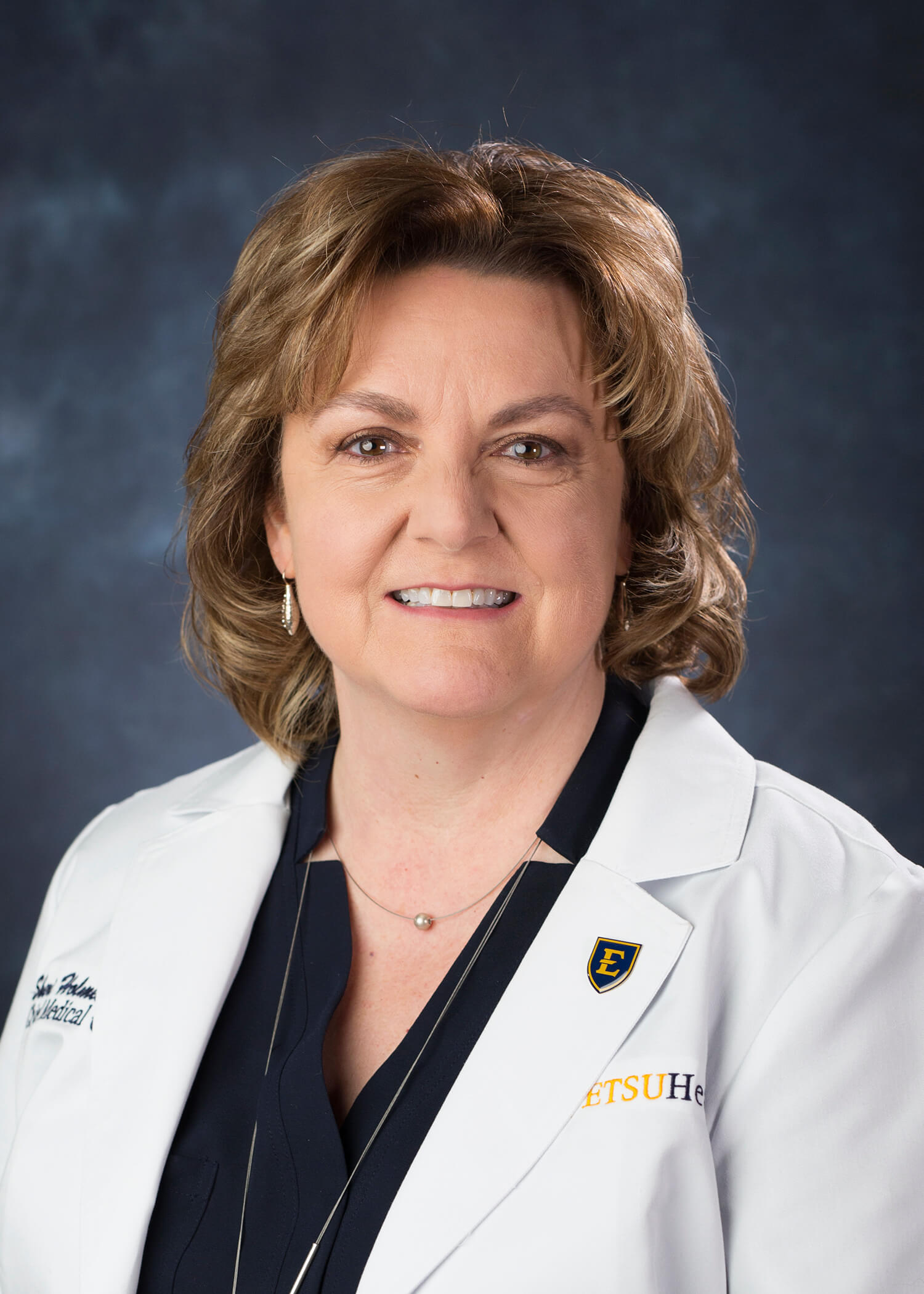 Portrait of Sheri Holmes, M.D., MBA, FACOG, CMO
