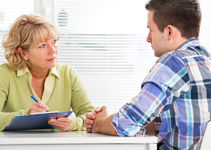 Female counselor with male patient